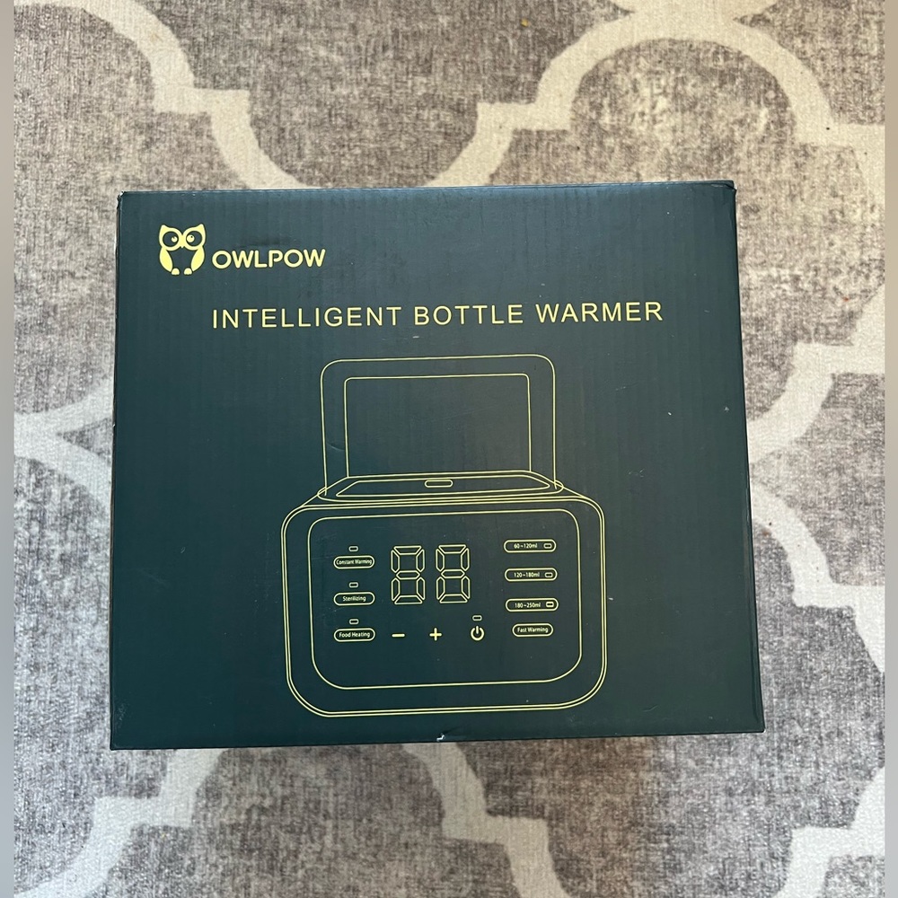 Owl Powl bottle warmer. Brand new never opened.
